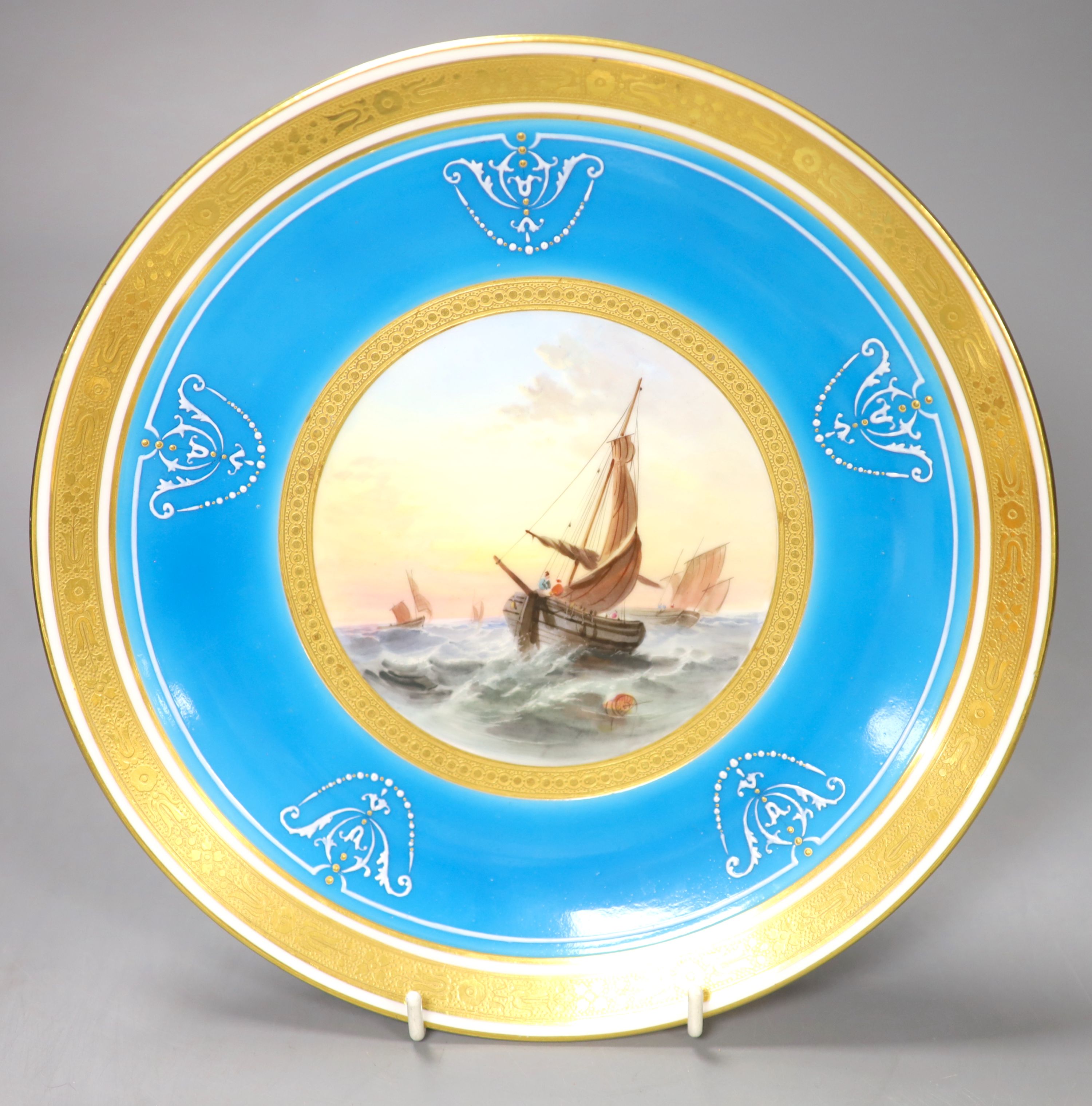 A Minton fine plate with two tooled gilt borders painted with sailboats in choppy water surrounded by a turquoise ground decorated with